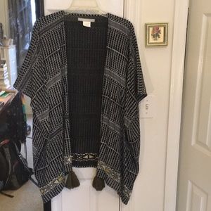 Boho chic open poncho with embroidery and tassels